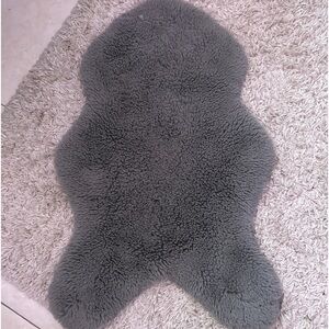 grey small cute shaped carpet for room